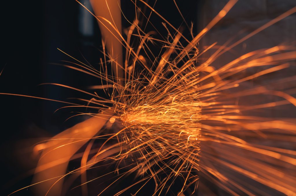 time lapse photography of sparks from metal working