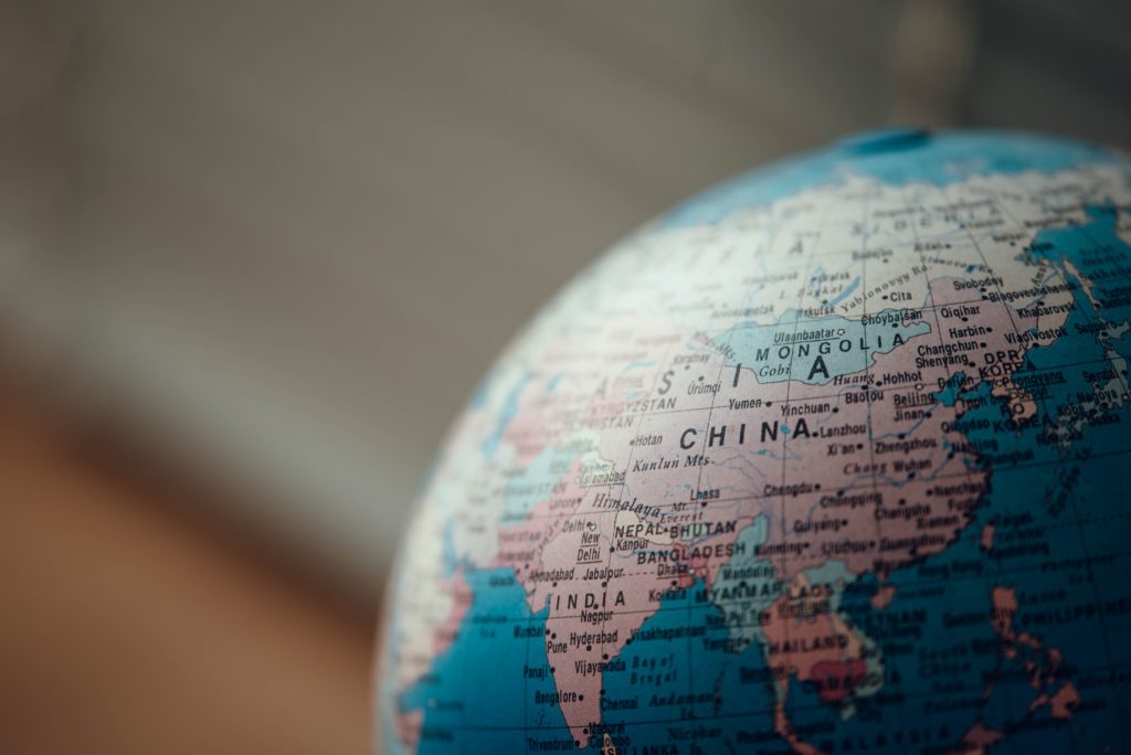 close up photo of blue desk globe with focus on China