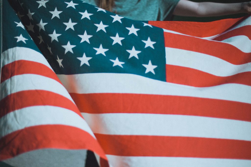 Person holding American flag